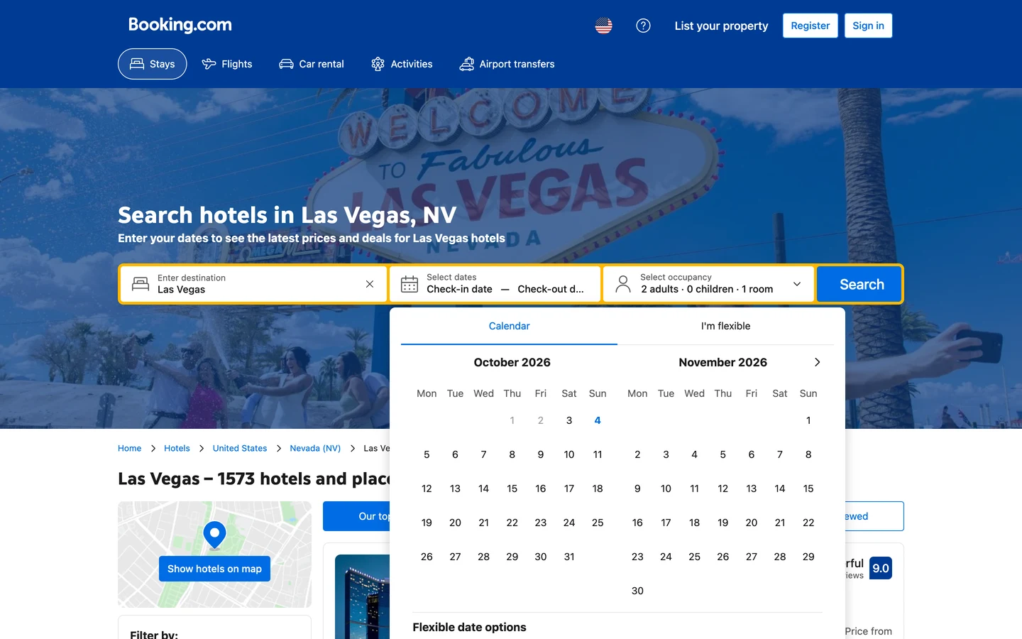 Booking.com Las Vegas city page with the same layout as the New York page: the heading Search hotels in Las Vegas, NV over a photo of the Welcome to Fabulous Las Vegas sign, the line Enter your dates to see the latest prices and deals for Las Vegas hotels, a search box with Las Vegas filled in and a date calendar open for October and November 2026, a breadcrumb of Home, Hotels, United States, Nevada (NV), Las Vegas, and the heading Las Vegas – 1573 hotels and places to stay.